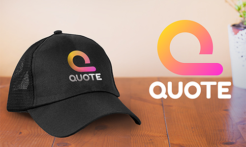 Black mesh cap with gradient Q logo and QUOTE text, wooden surface, branding layout