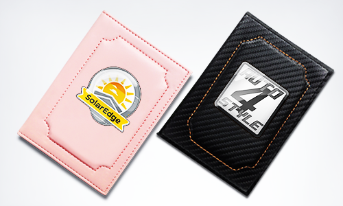 Two card holders with distinct logos: pink with SolarEdge sun emblem, black with AUTO 4 STYLE metallic plate