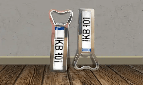 two bottle opener magnets on the floor