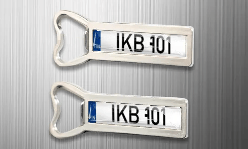 two magnet bottle openers on the fridge